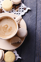 Obraz na płótnie Canvas Gentle colorful macaroons and coffee in mug