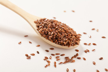 Linen seeds in a wooden spoon