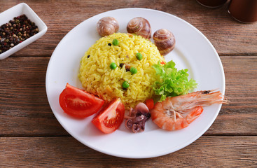 Seafood Paella on plate on table close-up
