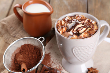 Cup of hot coffee with marshmallow and cup of milk with