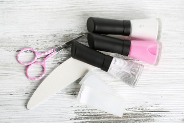 Fototapeta na wymiar French manicure set with strengthener,white tip polish,