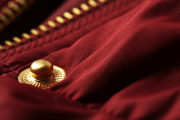 Metal button on clothes close up