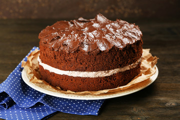 Delicious chocolate cake on table close-up