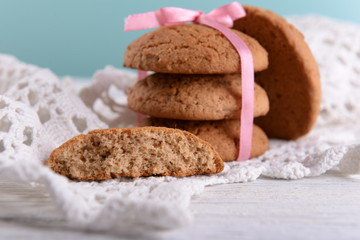 Tasty cookies on color wooden background