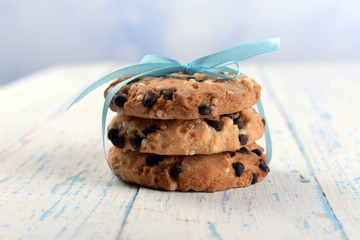 Tasty cookies on color wooden background