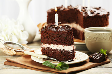 Delicious chocolate cake on table on light background