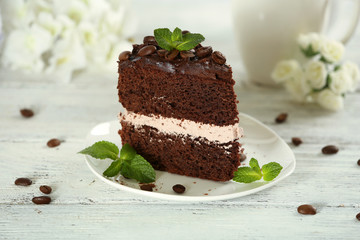 Delicious chocolate cake on table on light background