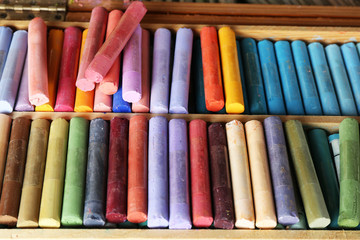 Colorful chalk pastels in box close up