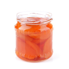 Homemade jar of apricot jam isolated on white background
