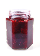 Homemade jar of plum jam isolated on white background