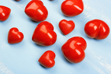 Decorative hearts on wooden background