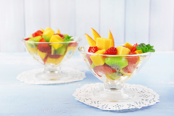 Fruit salad with mint in glassware