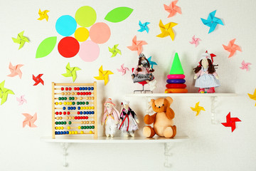 Shelves with toys in child room close-up