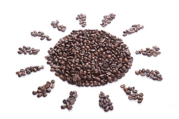 Roasted coffee beans in sun shape