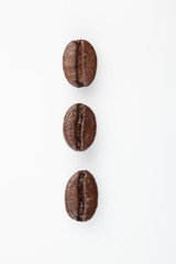 Close up of Three roasted coffee beans