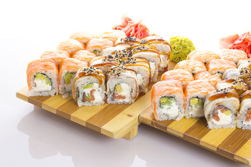 Salmon and eel sushi rolls on white background