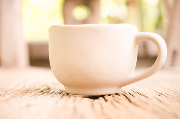 coffee cup on wooden board