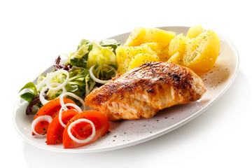 Fried chicken fillet, boiled potatoes and vegetable salad