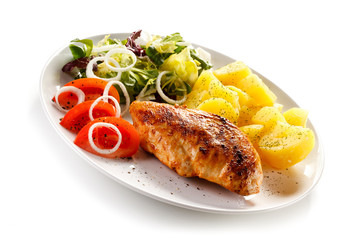 Fried chicken fillet, boiled potatoes and vegetable salad