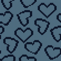 Knitted background with the image of hearts