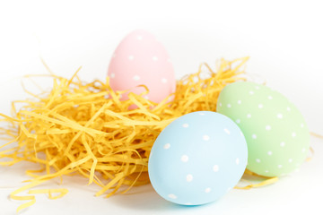 dotted easter eggs in a nest