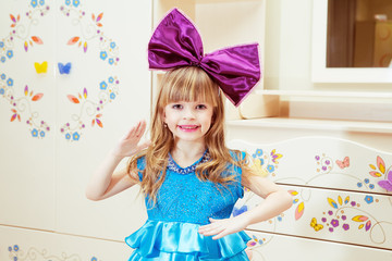 beautiful little girl in costume dolls. Interior shot © lokomotiv48