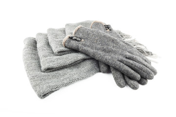Woolen scarf and gloves isolated on white background