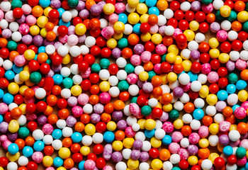 Fototapeta na wymiar Colorful sweet background with different sprinkles