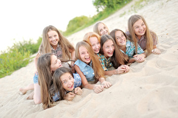 Portrait of joyful beautiful girlfriends on the nature