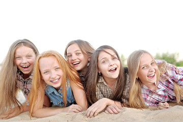 Portrait of joyful beautiful girlfriends on the nature