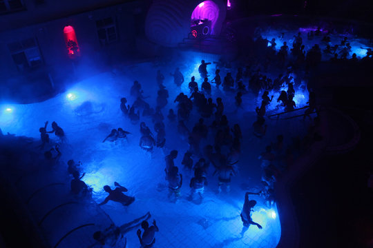 Night party in thermal bath in Budapest, Hungary.