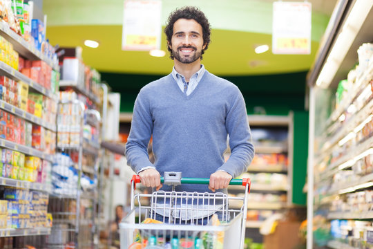 Attractive man shopping in a supermarket