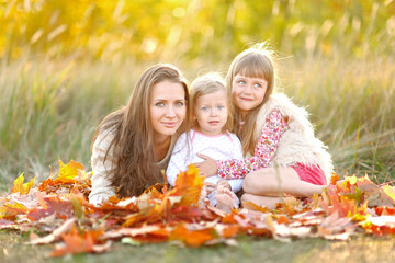 portrait of a beautiful family in autumn