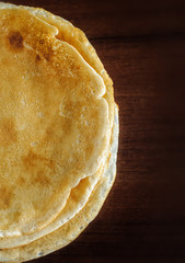 stack of delicious pancakes on a dark background