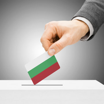 Voting concept - Male inserting flag into ballot box - Bulgaria