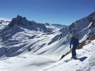 Fototapeta na wymiar Man skiing offpiste in the mountains of Austria