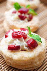 Baked strawberry dessert with cream. Sweet strawberry tart on ba