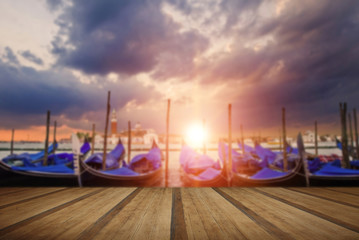 Gondolas bobbing in lagoon outside San Marco Piazza Venice Italy