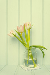 Still life image of Spring flowers with Instagram style cross pr