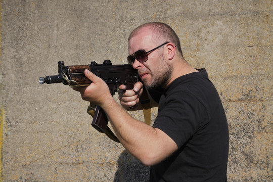 Man with Kalashnikov rifle