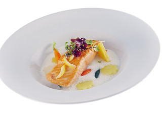 fried salmon with vegetables in frothy lemon sauce