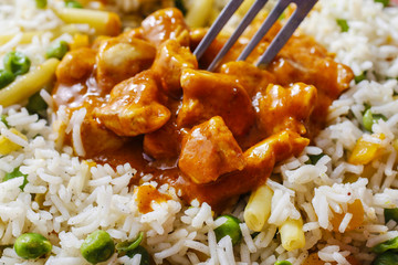 Chicken curry with basmati rice and green peas