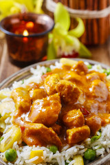 Chicken curry with basmati rice and green peas