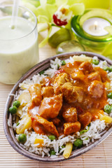 Chicken curry with basmati rice and green peas