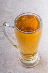 top view of glass of beer on stone background