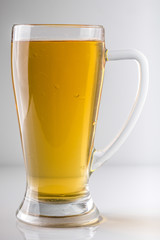 full glass of beer on white background