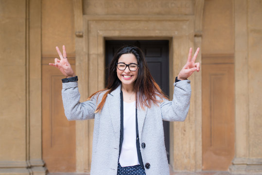 Happy teenager against historical building