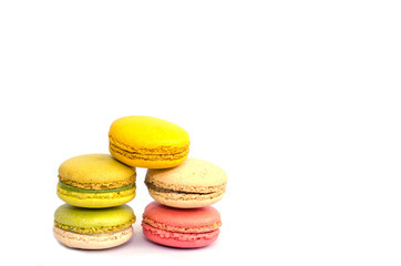 Colorful macarons on white background