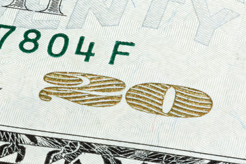 Close-up end stacked of 20 Dollar bill isolated on a white backg
