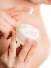 Skin care. Moisturizing cream in female hands